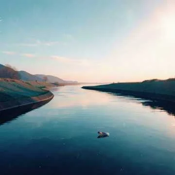 The river flows. The coffee cools in my hands.